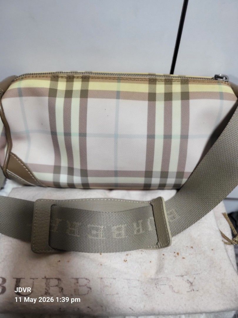 Burberry Shoulder Bag (Category: Luxury Bags & Wallets) located in Pasig City. Submitted by iba_by_jane (Listing ID 1437260500, Image 2). Description: - Authentic Burberry London shoulder bag - Classic check pattern - Beige leather trim and strap - Silver hardware - Includes dust bag - Small Barrel Bag - Needs Dry Cleaning - No Major Flaws, just need cleaning if maselan - What u see is what u get.