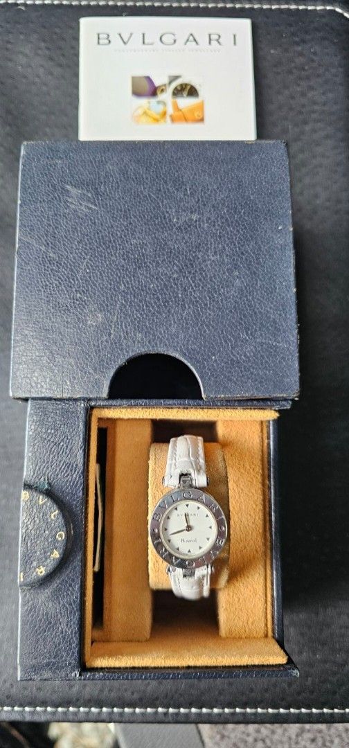 Bvlgari B.zero1 Watch (Category: Luxury Watches) located in Manila. Submitted by watchphil (Listing ID 1437266622, Image 2). Description: - Authentic Bvlgari B.zero1 watch - Features a pristine white dial - Elegant silver-tone hands and markers - Comfortable white leather strap - Includes original box and paperwork - Bvlgari logo engraved on the watch case - Model number and details on the watch back.
