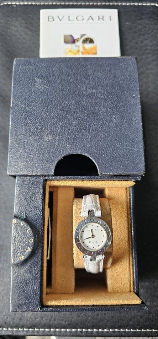 Bvlgari B.zero1 Watch (Category: Luxury Watches) located in Manila. Submitted by watchphil (Listing ID 1437266622, Image 1). Description: - Authentic Bvlgari B.zero1 watch - Features a pristine white dial - Elegant silver-tone hands and markers - Comfortable white leather strap - Includes original box and paperwork - Bvlgari logo engraved on the watch case - Model number and details on the watch back.