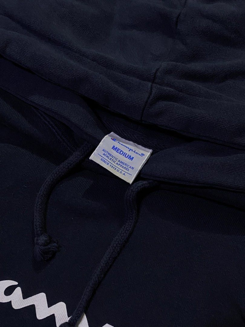 Champion Hoodie - Navy Blue - Medium (Category: Hoodies) located in Manila. Submitted by _thriftanddrip (Listing ID 1437238190, Image 3). Description: Medium Like new ₱399 +sf Navy blue Champion hoodie with the brand's logo on the front. It has a hood with drawstrings and a kangaroo pocket. The size is medium. The material composition is 100% cotton for the main body and 95% cotton, 5% polyurethane for the ribbing..