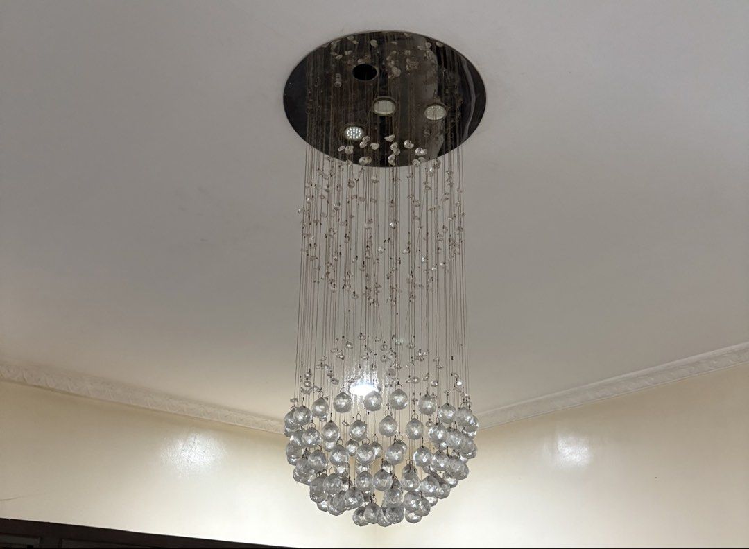 Crystal Ball Chandelier (Category: Lighting) located in Manila. Submitted by omiuttam (Listing ID 1437364877, Image 2). Description: - Elegant crystal ball chandelier - Chrome circular base - Clear crystal beads in a spherical shape - Decorative lighting - Perfect for living rooms, dining areas, and entryways.