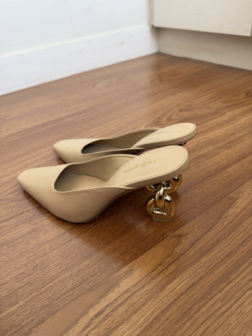 Cult Gaia Chain Heel Mules (Category: Sneakers & Footwear) located in Mandaue City. Submitted by melbafelis47966 (Listing ID 1437273738, Image 3). Description: - Stylish mules in a versatile neutral color. - Unique chain heel design for a sophisticated look. - Pointed toe and easy slip-on style. - Features 'cult gaia' branding on the insole. - Perfect for adding a touch of elegance to any outfit. -free shipment.