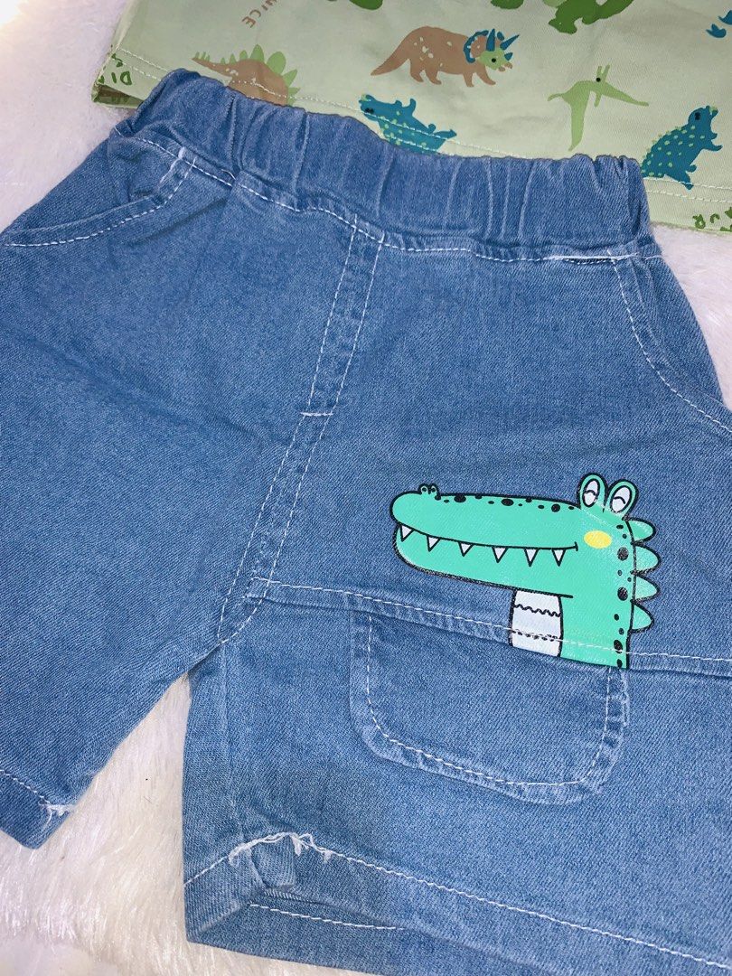 Cute little dino outfit (Category: Babies & Kids Fashion) located in Pasig City. Submitted by nyca1989 (Listing ID 1437305278, Image 2). Description: 🦖☀️ Cute little dino outfit for your little explorer! ☀️🦖 2-piece baby boy summer set featuring: 💚 Green dinosaur print t-shirt 👖 Light blue denim shorts Perfect for playtime, outings, and comfy everyday wear 🧸✨ 💸 Only ₱200 Super cute and budget-friendly — grab it now before it’s gone! 🦕 Feel
