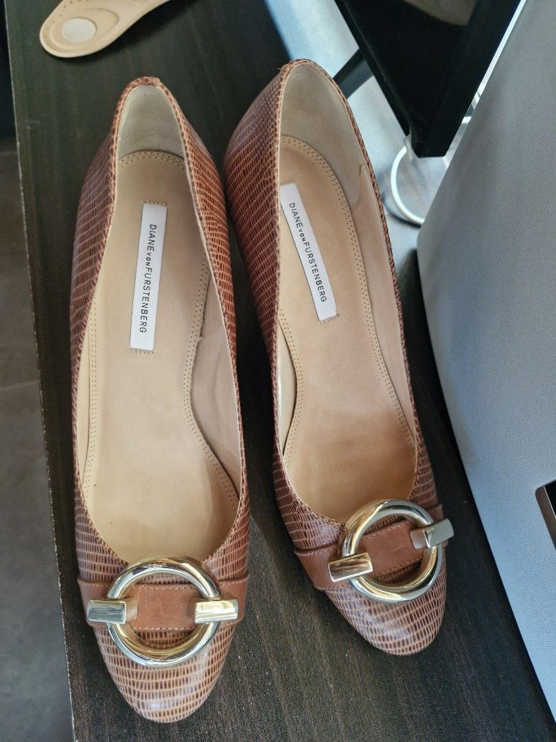 Diane von Furstenberg Brown Heels (Category: Heels) located in Cavite. Submitted by soeymarie (Listing ID 1437264857, Image 3). Description: - Diane von Furstenberg heels - Color: Brown - Features a textured design - Pointed toe - Gold logo detail on the sole - Buckle detail on top.