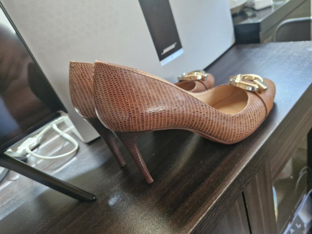 Diane von Furstenberg Brown Heels (Category: Heels) located in Cavite. Submitted by soeymarie (Listing ID 1437264857, Image 2). Description: - Diane von Furstenberg heels - Color: Brown - Features a textured design - Pointed toe - Gold logo detail on the sole - Buckle detail on top.