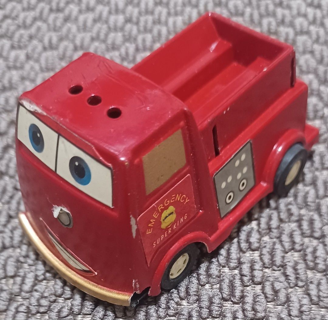 Emergency Super King Toy Truck (Category: Vehicle & Diecast Models) located in Quezon City. Submitted by wjmae (Listing ID 1437286757, Image 1). Description: - Red toy truck - Features 'Emergency Super King' text - Smiling face design - Truck bed in the back - Black wheels - Vintage toy - Shows wear and tear.