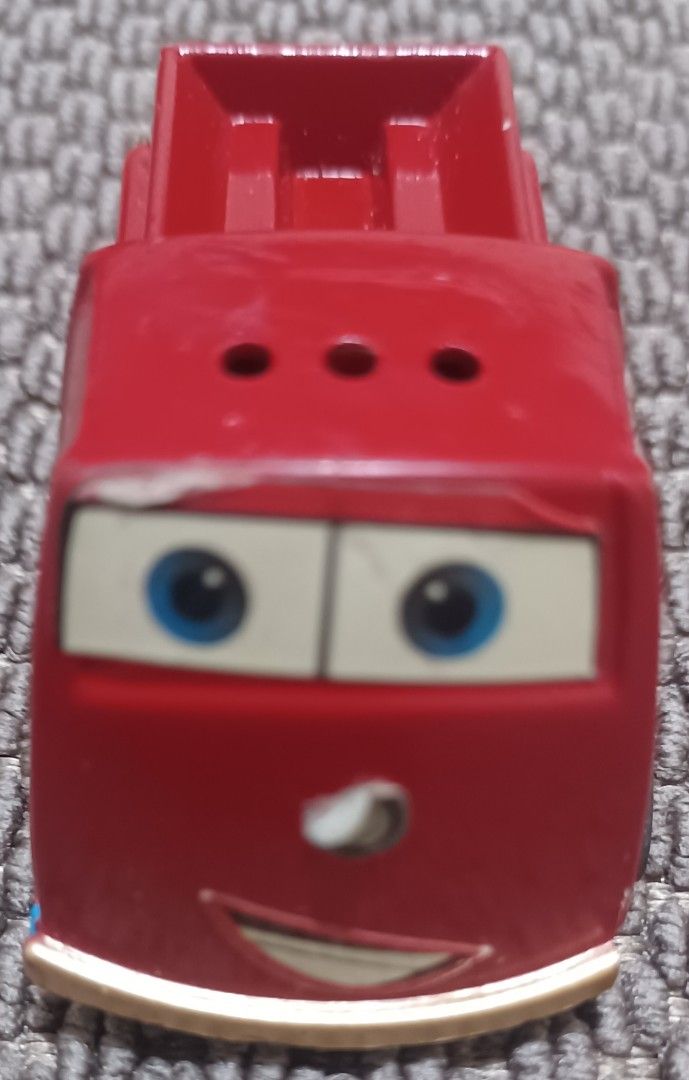 Emergency Super King Toy Truck (Category: Vehicle & Diecast Models) located in Quezon City. Submitted by wjmae (Listing ID 1437286757, Image 2). Description: - Red toy truck - Features 'Emergency Super King' text - Smiling face design - Truck bed in the back - Black wheels - Vintage toy - Shows wear and tear.