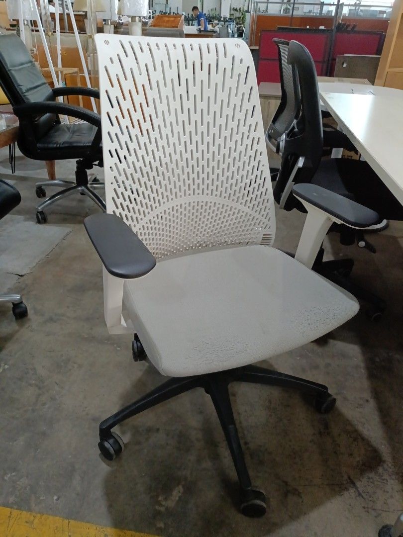 Ergonomic Office Chair with White Mesh Back (Category: Office Furniture & Fixtures) located in Paranaque City. Submitted by materesadimasaca (Listing ID 1437261975, Image 1). Description: - Ergonomic office chair - White mesh back - Light grey seat - Features armrests - Black base with wheels - Designed for comfort and support - Suitable for long work hours - Ideal for home and office use.