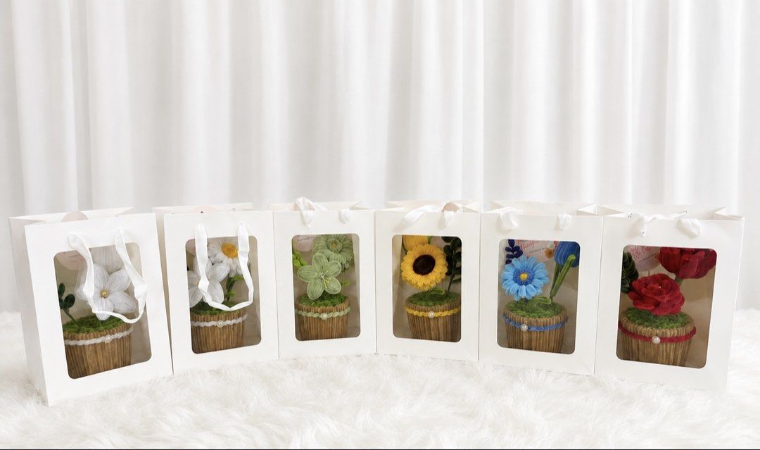 Flower Pot gifts or souvenirs (Category: Artificial Plants & Flowers) located in Bulacan. Submitted by avpammy (Listing ID 1437337146, Image 3). Description: - Handmade fuzzy wire - Features sunflowers, roses, and tulips - Ideal gift for birthdays, anniversaries, or any occasions - Can give a discount for bulk order of 15pcs above Additional fee for a gift bag for ₱50 only.