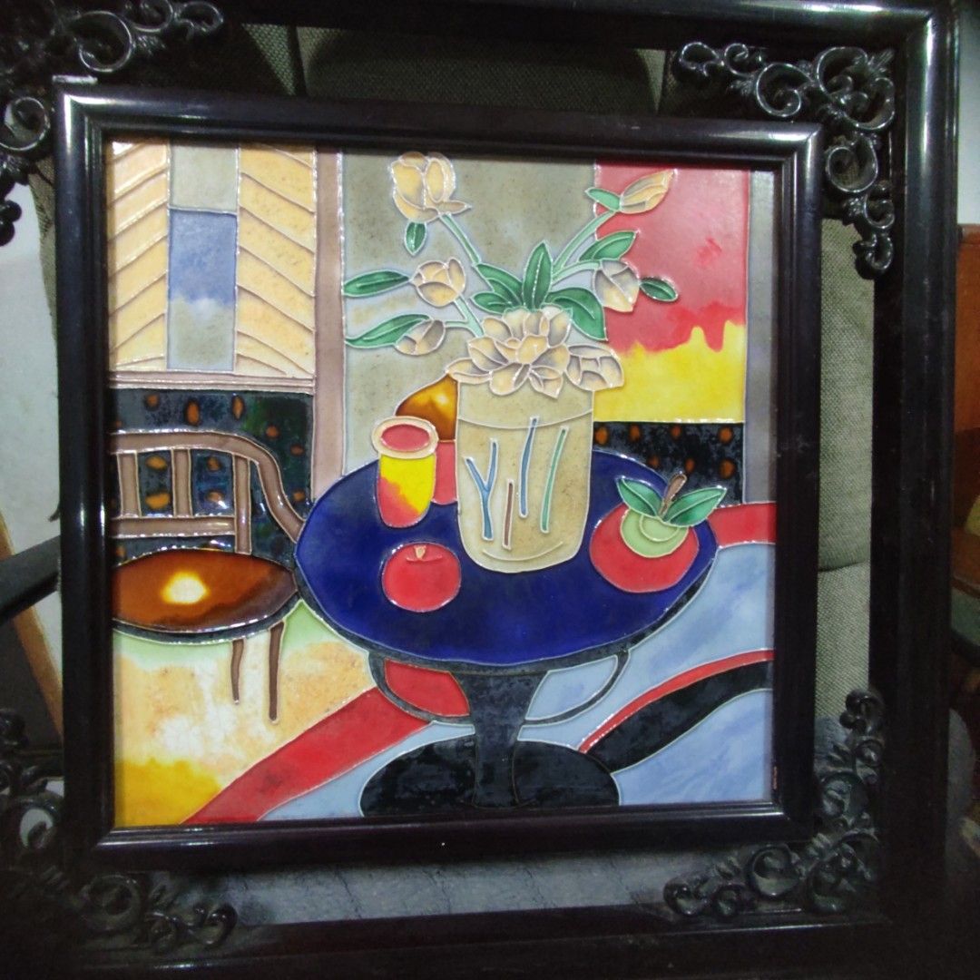 Framed Ceramic Tile Art (Category: Wall Decor) located in Las Pinas. Submitted by lawki_stuff (Listing ID 1437214743, Image 2). Description: - Framed ceramic tile artwork - Depicts a vase of flowers and abstract elements - Dark-colored frame with decorative corner accents - Square-shaped - Size 18" x 18".