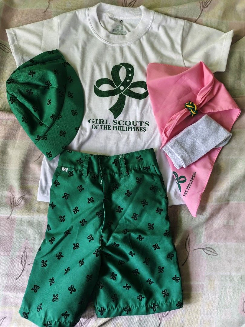 Girl Scout Twinkler Uniform Set (Category: Sets or Coordinates) located in Manila. Submitted by analyzeme (Listing ID 1437266863, Image 1). Description: Complete Girl Scouts of the Philippines uniform set. Includes a white t-shirt with the Girl Scouts logo, green shorts, a green cap, a pink neckerchief, and a white neckerchief slide. Perfect for young scouts. size 12.
