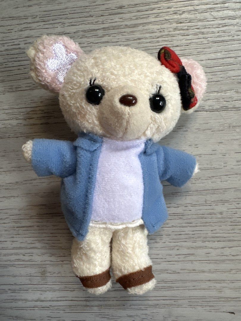 Girly Bear Strap Plush Toy - T-ARTS (Category: Plushies & Soft Toys) located in Cainta. Submitted by shopbyyna (Listing ID 1437270847, Image 1). Description: - Cute bear plush toy by T-ARTS. - Features a bear design with a blue jacket and bow. - Perfect for collectors or as an accessory. - Small and easy to carry around..