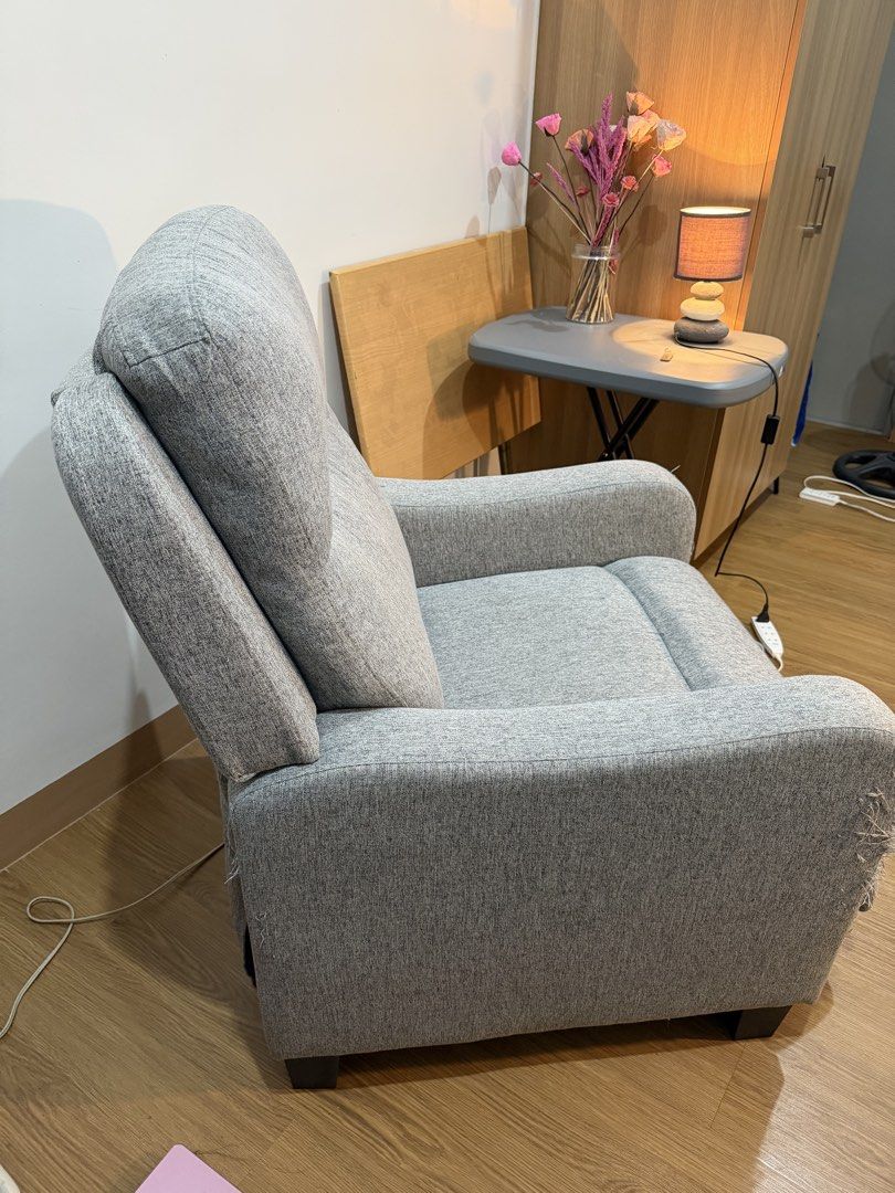 Grey Fabric Recliner Chair (Category: Chairs) located in Quezon City. Submitted by bernsbernsbern (Listing ID 1437216979, Image 2). Description: - in good condition EXCEPT of loose threads due to cat scratches - delivery fee c/o buyer -buyer must be within metro manila only - if pick up: available only on weekends Loc: Xavierville Loyola Heights QC .