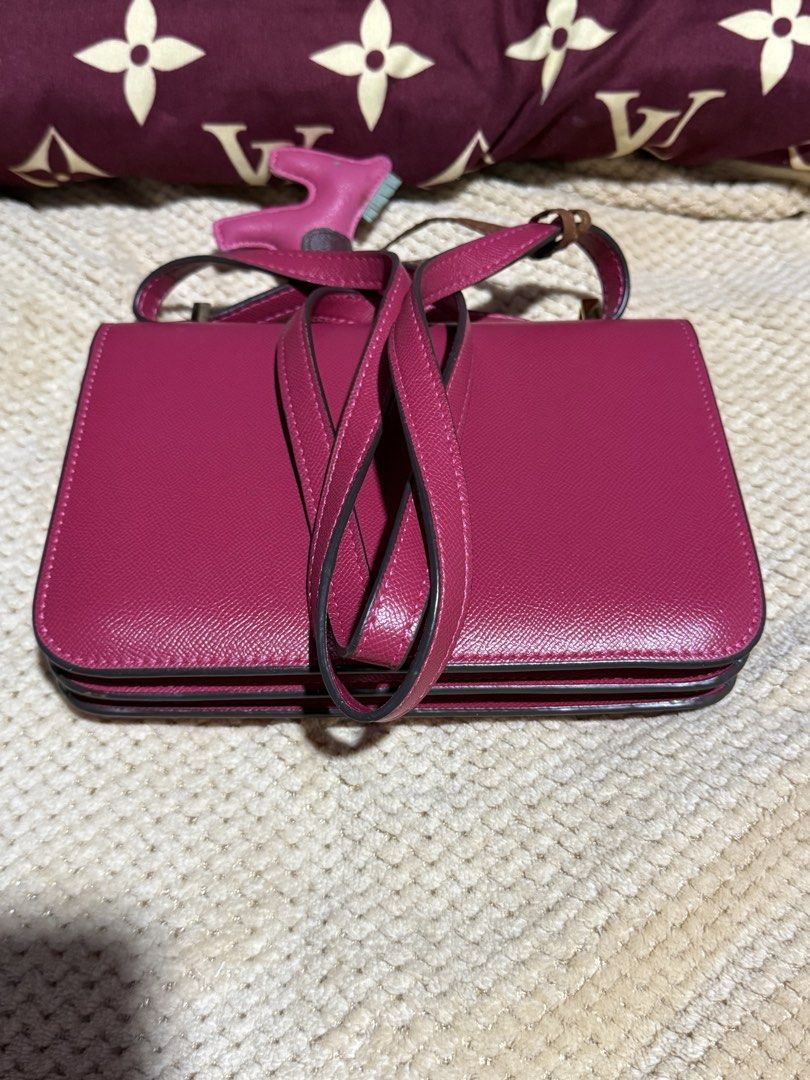 Hermes Shoulder Bag (Category: Luxury Bags & Wallets) located in Manila. Submitted by devorahlop39116 (Listing ID 1437367807, Image 2). Description: - Authentic Hermes shoulder bag - Vibrant pink color - Gold-tone 'H' clasp - Includes a horse charm - Interior zippered pocket - Made in France - Minor wear on hardware and lining.