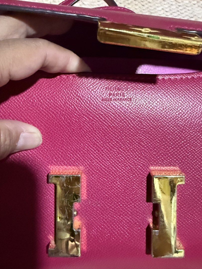 Hermes Shoulder Bag (Category: Luxury Bags & Wallets) located in Manila. Submitted by devorahlop39116 (Listing ID 1437367807, Image 3). Description: - Authentic Hermes shoulder bag - Vibrant pink color - Gold-tone 'H' clasp - Includes a horse charm - Interior zippered pocket - Made in France - Minor wear on hardware and lining.