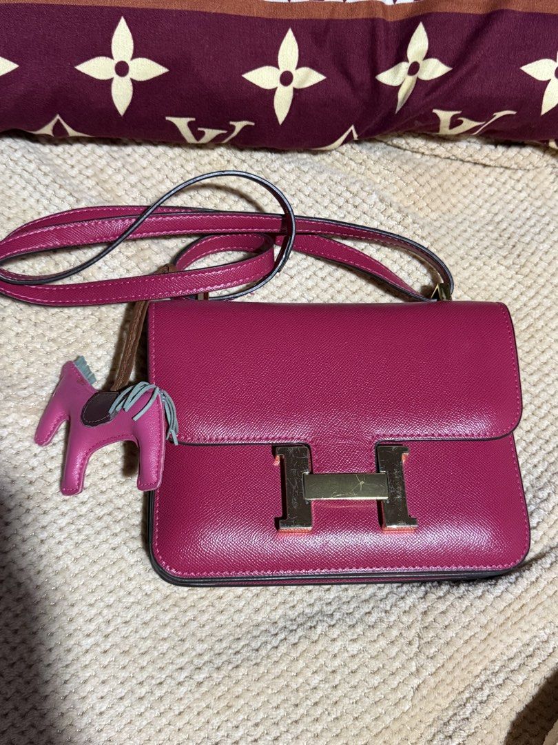 Hermes Shoulder Bag (Category: Luxury Bags & Wallets) located in Manila. Submitted by devorahlop39116 (Listing ID 1437367807, Image 1). Description: - Authentic Hermes shoulder bag - Vibrant pink color - Gold-tone 'H' clasp - Includes a horse charm - Interior zippered pocket - Made in France - Minor wear on hardware and lining.