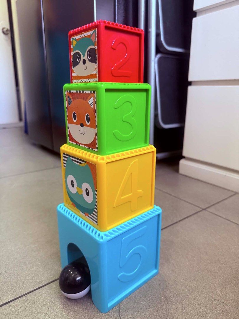 Infantino Busy Stack & Nest Ball Drop (Category: Infant Playtime) located in Makati City. Submitted by eyes_jade (Listing ID 1437289385, Image 2). Description: - Fisher-Price Stacking Toy - Features colorful blocks with animal faces and numbers. - Includes a base block with a dog face and a ball. - Blocks stack to create a tower. - Designs include a mirror and various animal faces. - Helps develop fine motor skills. - Teaches shapes and colors..