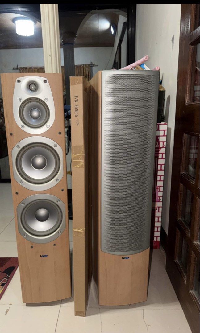 Infinity Beta 50 (Category: Soundbars, Speakers & Amplifiers) located in Plaridel. Submitted by sxiren (Listing ID 1437332744, Image 1). Description: - Pair of Infinity speakers - Light wood finish - Silver speaker grill - Tall, rectangular design - Features port and speaker terminals - Model number visible on the back.
