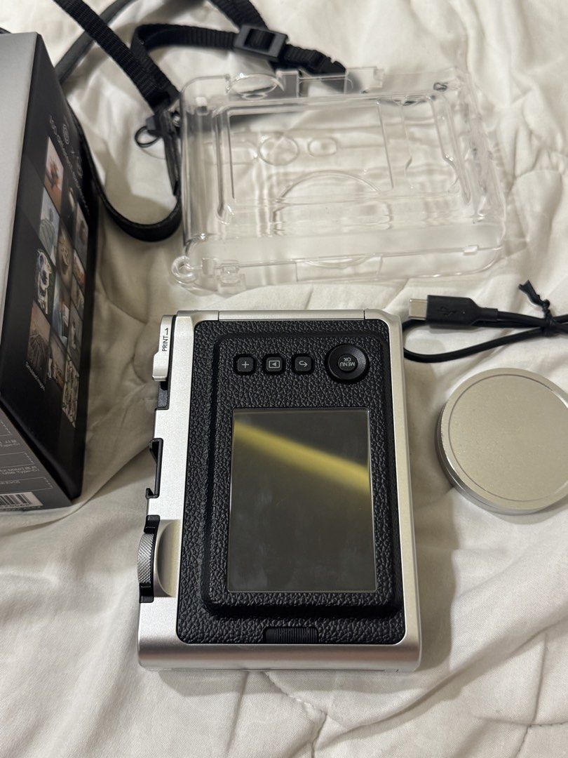 Instax mini evo (Category: Cameras) located in Makati City. Submitted by airahern (Listing ID 1437300938, Image 3). Description: - bought last August 2025 (complete with receipt, box and charger) - free case, screen protector (installed already) & lens cap - no flaws RFS: i don’t use it anymore .