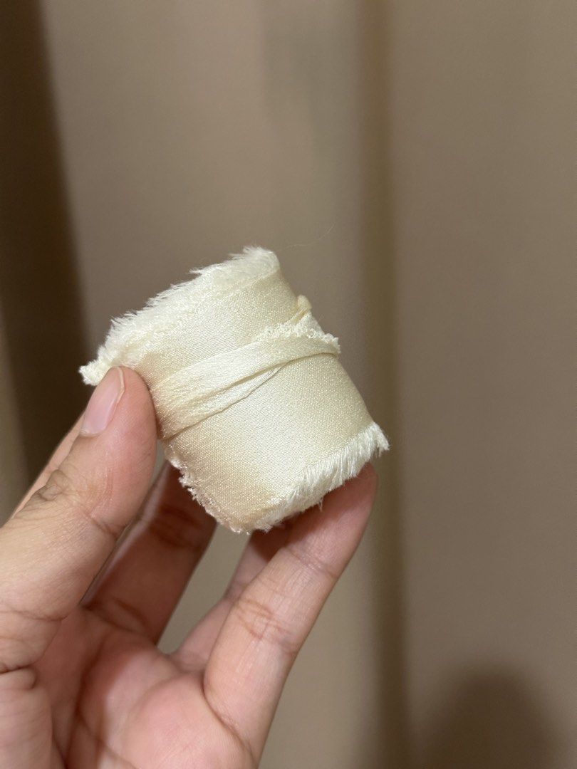 Ivory/Cream Silk Ribbon (Category: Craft Supplies & Tools) located in Malabon City. Submitted by yanyanpreloved (Listing ID 1437325306, Image 3). Description: - 5 pcs. ‼️5 pcs‼️Ivory silk ribbon - Ideal for crafts and gift wrapping - Adds an elegant touch - Features a soft, slightly frayed edge - Creamy ivory color - Each roll individually wrapped New! RFS: Extra.