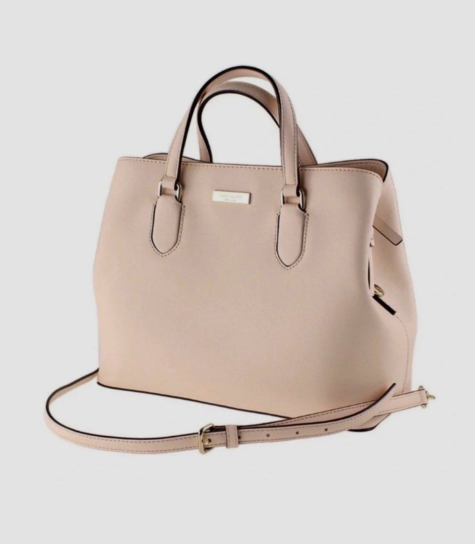 Kate Spade New York Laurel Way (Category: Luxury Bags & Wallets) located in Quezon City. Submitted by prelovedbyaisc (Listing ID 1437263660, Image 1). Description: - Kate Spade handbag - Light pink color - Top handle and detachable shoulder strap - Rectangular shape - Gold-tone logo - Made of leather - Multiple interior compartments - bought in Las Vegas Outlet.
