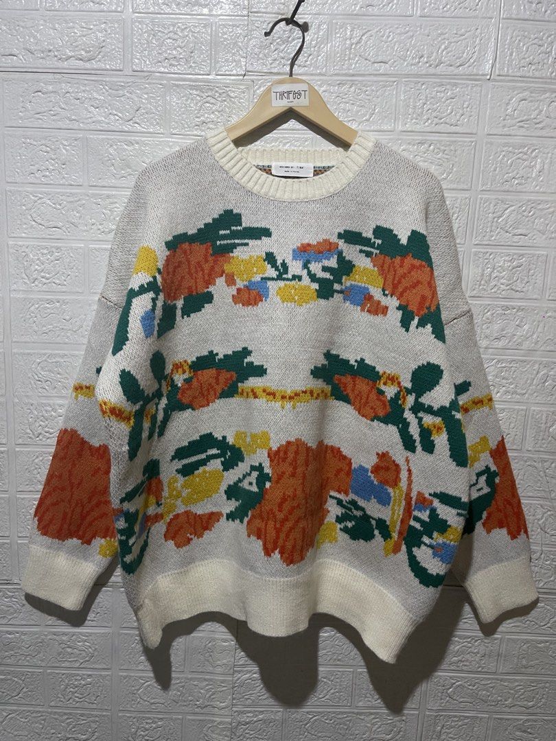 KNITTED SWEATER (Category: Coats, Jackets and Outerwear) located in Quezon City. Submitted by davidso682 (Listing ID 1437361347, Image 1). Description: - Cream-colored sweater - Features a floral design - Round neckline and long sleeves - Made in Korea - Floral pattern includes orange, yellow, green, and blue colors - Ribbed hem and cuffs.