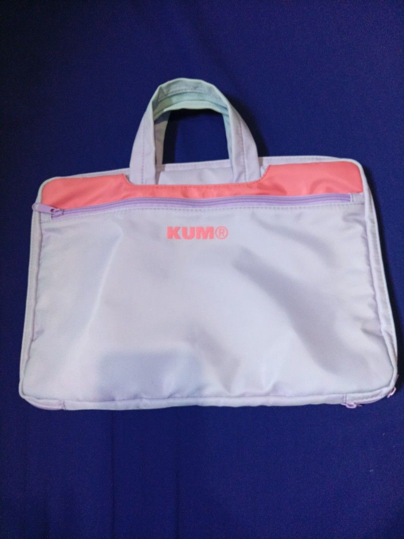 Kumo Laptop Bag (Category: Laptop Bags & Sleeves) located in Manila. Submitted by tinygazo90639 (Listing ID 1437252123, Image 1). Description: - Kumo laptop bag - Light purple body with pink accent - Handle for easy carrying - Secure zipper closure - Kumo logo on the front - Made of smooth, possibly nylon-like material - Perfect for laptops and other items.