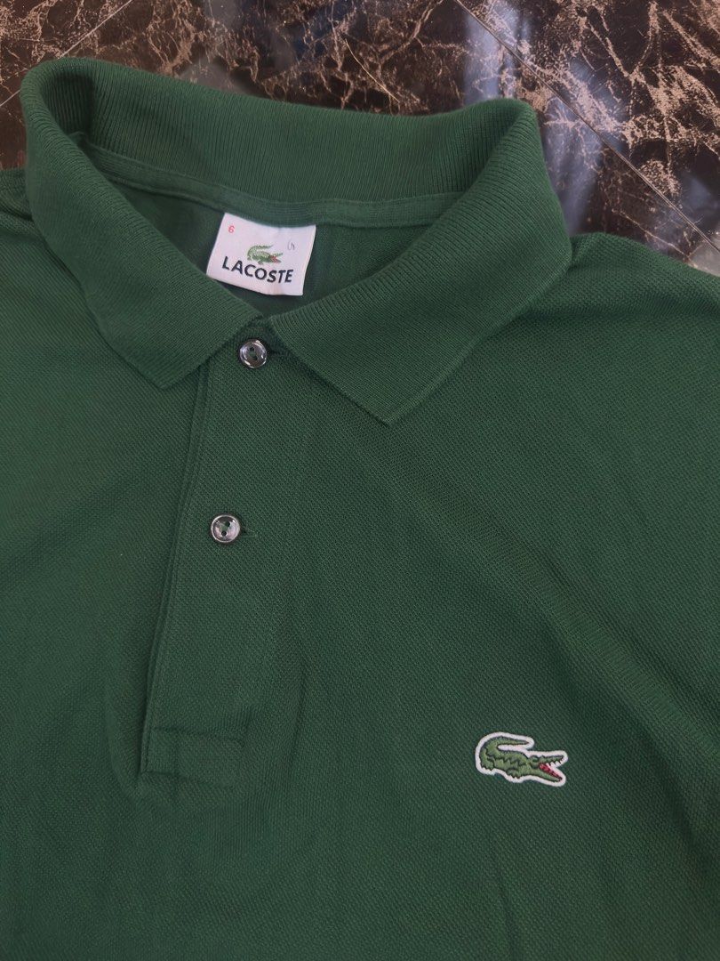 Lacoste Green Polo Shirt (Category: Tshirts & Polo Shirts ) located in Manila. Submitted by collect__ph (Listing ID 1437282648, Image 3). Description: - Authentic Lacoste polo shirt - Vibrant green color - Features the iconic crocodile logo - Collared neckline with button-up closure - Standard fit - Comfortable fabric - Perfect for casual wear - Dimes : 28” x 23” .