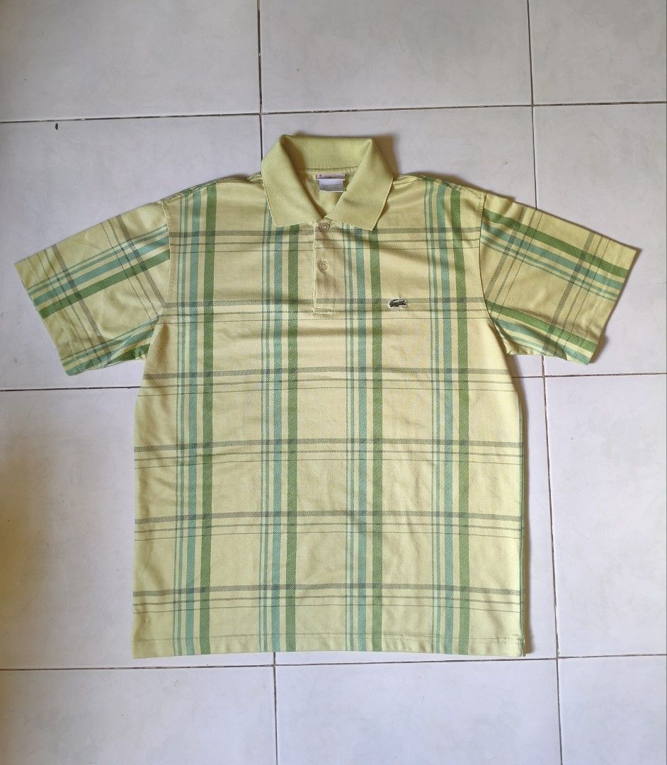 Lacoste Plaid Polo Shirt (Category: Tshirts & Polo Shirts ) located in Manila. Submitted by fromarchives (Listing ID 1437233592, Image 1). Description: - Lacoste plaid polo shirt - Yellow and green color - Classic polo collar - Short sleeves - Lacoste logo on chest - Button-up placket - Lightweight fabric.