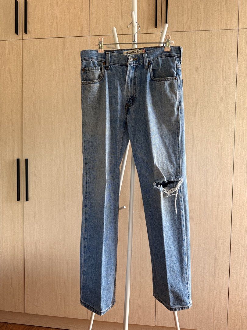Levi's 550 Distressed Relaxed Fit Jeans (Category: Jeans) located in Quezon City. Submitted by thrift.tingz (Listing ID 1437262736, Image 1). Description: - Levi's 550 Relaxed Fit jeans - Light wash - Distressed knee detail - Classic five-pocket design - Button and zipper closure - Levi's red tab visible - Relaxed fit - Dimensions: 29 in Waist x 39 in Length.