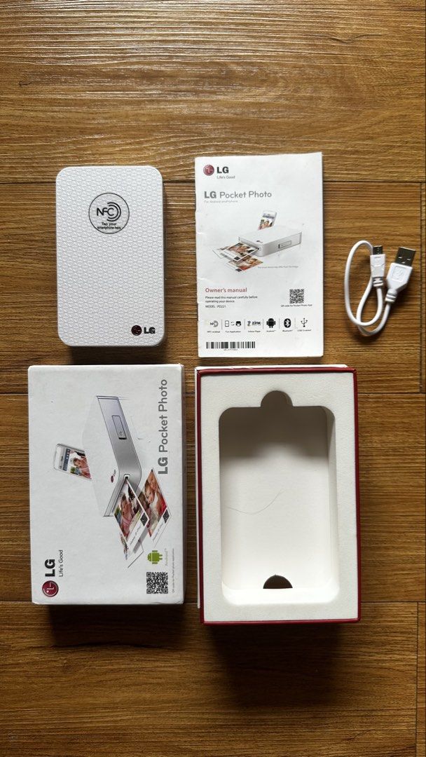 LG Pocket Photo PD221 Portable Printer (Category: Printers, Scanners & Copiers) located in Paranaque City. Submitted by safedolphin.dc2bd2 (Listing ID 1437280769, Image 1). Description: - Vintage LG Pocket Photo PD221 portable printer - Used twice (inubos lang ung kasamang photo paper pack) - Uses ZINK photo paper - Works with Android only - Includes box, manual and USB cable - Device is working (charging, full charge, ON/OFF) - Bought in 2014 in