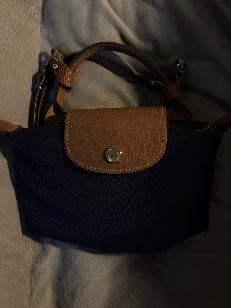 Longchamp Le Pliage Mini (Category: Luxury Bags & Wallets) located in Cebu City. Submitted by declutterie13 (Listing ID 1437316587, Image 2). Description: Authentic Le Pliage Mini (Navy Blue) with Free Strap and Strap Link .
