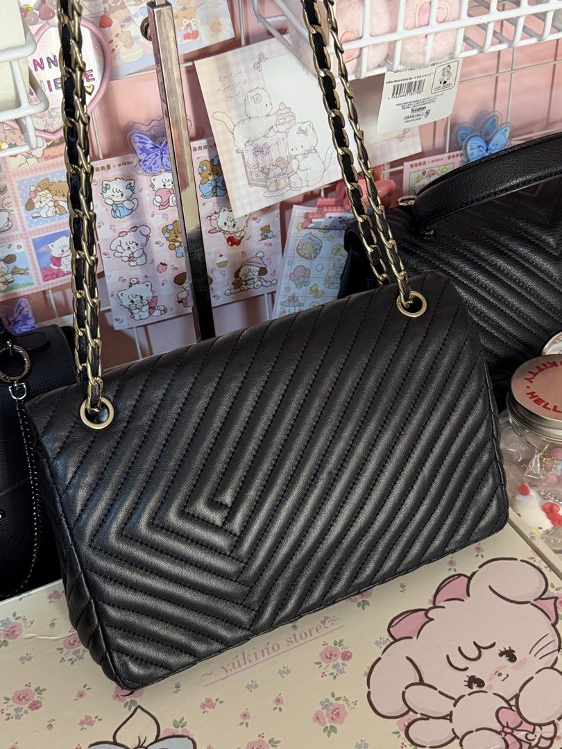 Louis Quatorez quilted convertible (Category: Luxury Bags & Wallets) located in Batangas. Submitted by declutterwithclare_ (Listing ID 1437383745, Image 3). Description: Like new condition ✨ Nothing to explain Genuine leather .