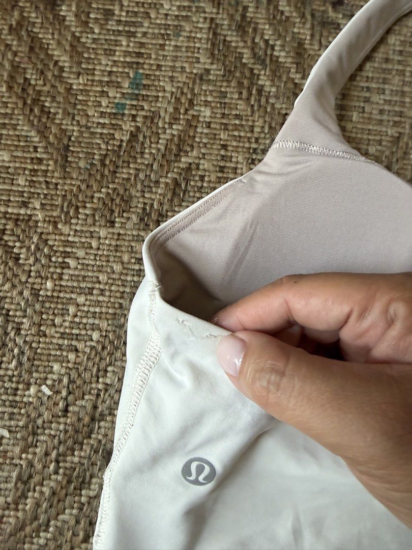 Lululemon Energy Cross-Strap Longline Bra (Category: Activewear) located in Manila. Submitted by nicauliflower77 (Listing ID 1437282360, Image 3). Description: See closeup photo of loose thread because I removed inside tag 🥲 Used once only!! RFS: not comfy with cleavage exposure.