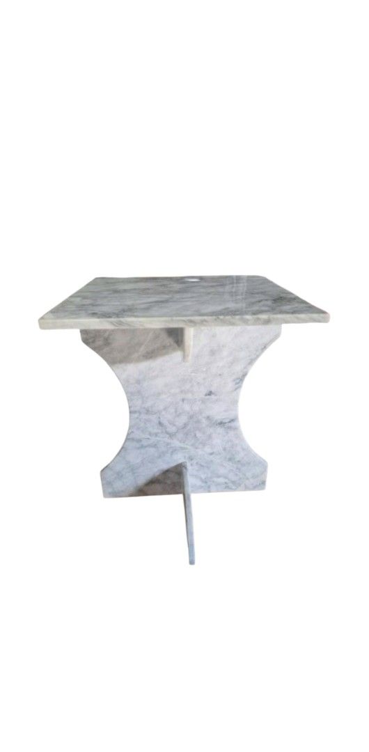 Marble Side Table (Category: Tables & Sets) located in Pasig City. Submitted by kjh000522 (Listing ID 1437306620, Image 1). Description: - Elegant marble side table - Square tabletop - Unique base design - Crafted from marble with natural color variations - Ideal for living rooms or bedrooms - Perfect as a side table or decorative accent.
