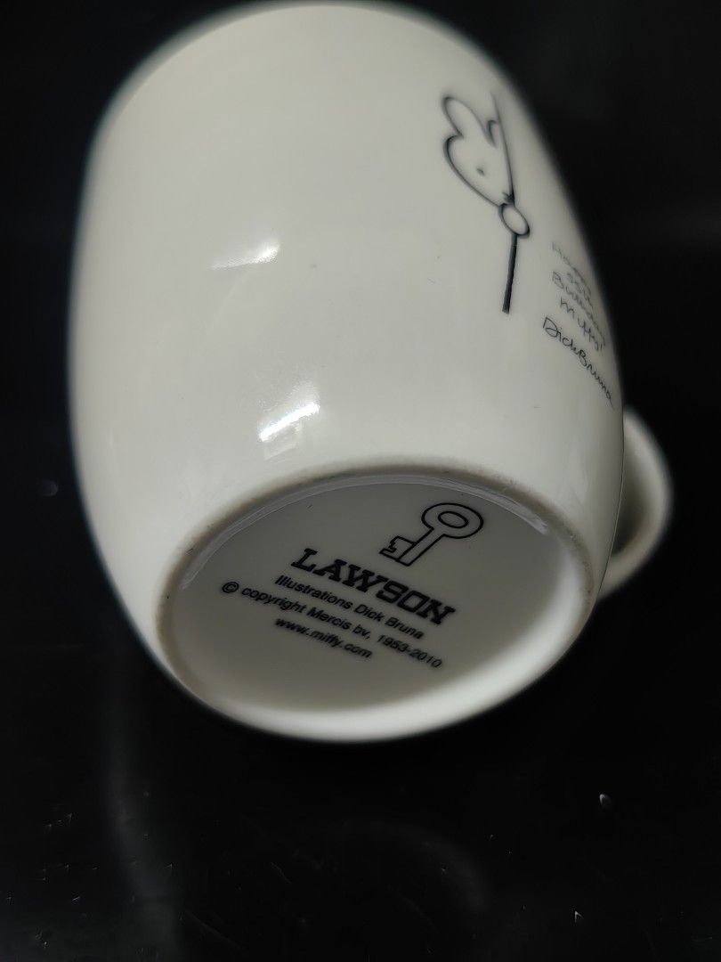 Miffy 65th Anniversary Mug (Category: Coffee & Tea Tableware) located in Rizal. Submitted by gkstcenit (Listing ID 1437297826, Image 3). Description: - Miffy design mug - Features a bunny outline and full Miffy illustration - Includes a handle and curved shape - Lawson collaboration - Approximately 4 inches tall.