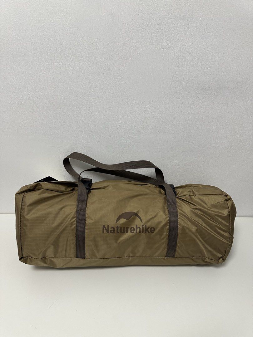 Naturehike 3 Person Camping Tent (Category: Hiking & Camping) located in Pasay City. Submitted by beyaaaa21 (Listing ID 1437330601, Image 1). Description: - Naturehike camping tent for 2-3 persons. - Unfolded size: 220x290x125cm. - Packing size: 52x16x16cm. - Lightweight: Approximately 3.1kg (6.8 lbs). - Fabric: 210T Polyester coated silver. - Color: Brown. - Includes a carrying bag with handles..