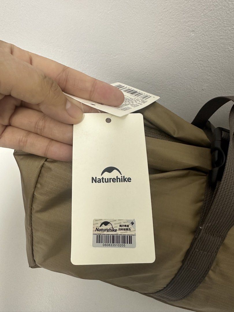 Naturehike 3 Person Camping Tent (Category: Hiking & Camping) located in Pasay City. Submitted by beyaaaa21 (Listing ID 1437330601, Image 2). Description: - Naturehike camping tent for 2-3 persons. - Unfolded size: 220x290x125cm. - Packing size: 52x16x16cm. - Lightweight: Approximately 3.1kg (6.8 lbs). - Fabric: 210T Polyester coated silver. - Color: Brown. - Includes a carrying bag with handles..