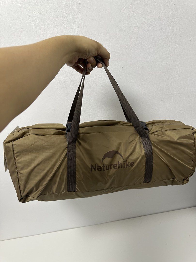 Naturehike 3 Person Camping Tent (Category: Hiking & Camping) located in Pasay City. Submitted by beyaaaa21 (Listing ID 1437330601, Image 3). Description: - Naturehike camping tent for 2-3 persons. - Unfolded size: 220x290x125cm. - Packing size: 52x16x16cm. - Lightweight: Approximately 3.1kg (6.8 lbs). - Fabric: 210T Polyester coated silver. - Color: Brown. - Includes a carrying bag with handles..