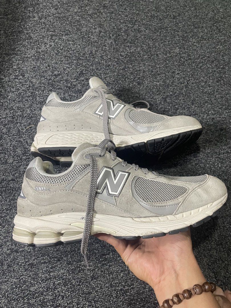 New Balance 2002R Grey Sneakers (Category: Sneakers) located in Cebu City. Submitted by lucky.finds.ph (Listing ID 1437214998, Image 2). Description: - New Balance 2002R - Grey colorway - Mesh and suede upper - Iconic 'N' logo - White and black sole - Grey laces - issue sign of usage.