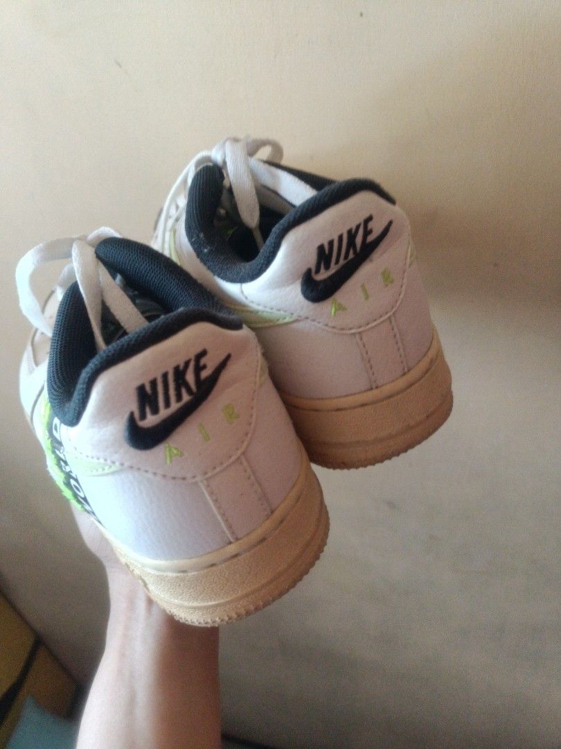 Nike Air Force 1 'Worldwide' Sneakers (Category: Sneakers) located in Manila. Submitted by kicks_shoes (Listing ID 1437398968, Image 3). Description: - Nike Air Force 1 'Worldwide' sneakers - White leather upper - Light green swoosh - Black accents - 'NIKE' branding on heel - 'WORLDWIDE' text on side - Light brown soles - White laces.