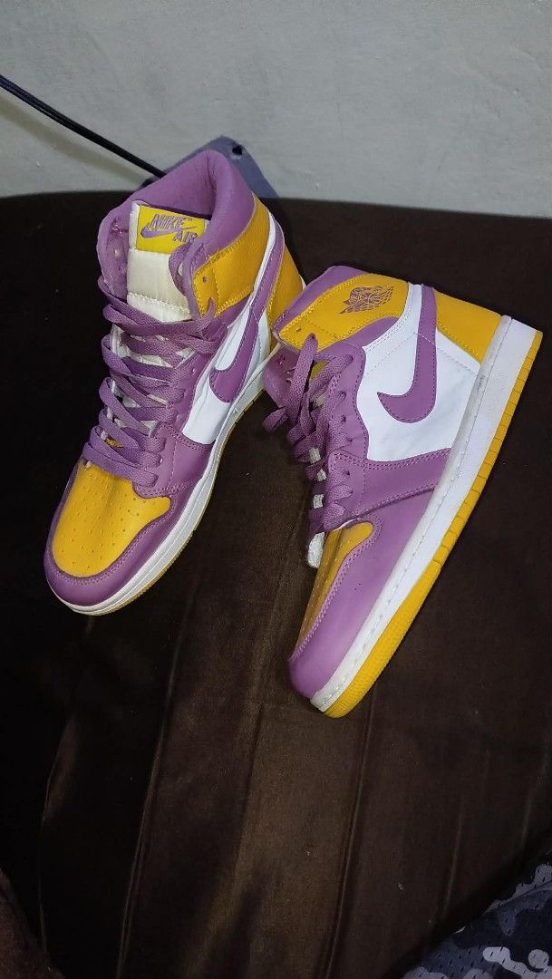 Nike Air Jordan 1 High OG (Category: Sneakers) located in Manila. Submitted by real_rnt01 (Listing ID 1437286253, Image 1). Description: - Nike Air Jordan 1 High OG sneakers - Colorway: Purple, Yellow, and White - Size: US 8.5, EUR 42 - Condition: Shows some wear on soles - No issue ❌❌ LOC NOVALICHES QC AREA 📥📩.