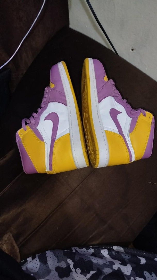 Nike Air Jordan 1 High OG (Category: Sneakers) located in Manila. Submitted by real_rnt01 (Listing ID 1437286253, Image 2). Description: - Nike Air Jordan 1 High OG sneakers - Colorway: Purple, Yellow, and White - Size: US 8.5, EUR 42 - Condition: Shows some wear on soles - No issue ❌❌ LOC NOVALICHES QC AREA 📥📩.