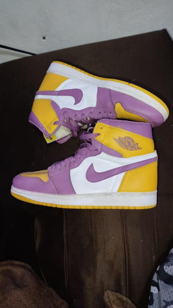 Nike Air Jordan 1 High OG (Category: Sneakers) located in Manila. Submitted by real_rnt01 (Listing ID 1437286253, Image 3). Description: - Nike Air Jordan 1 High OG sneakers - Colorway: Purple, Yellow, and White - Size: US 8.5, EUR 42 - Condition: Shows some wear on soles - No issue ❌❌ LOC NOVALICHES QC AREA 📥📩.