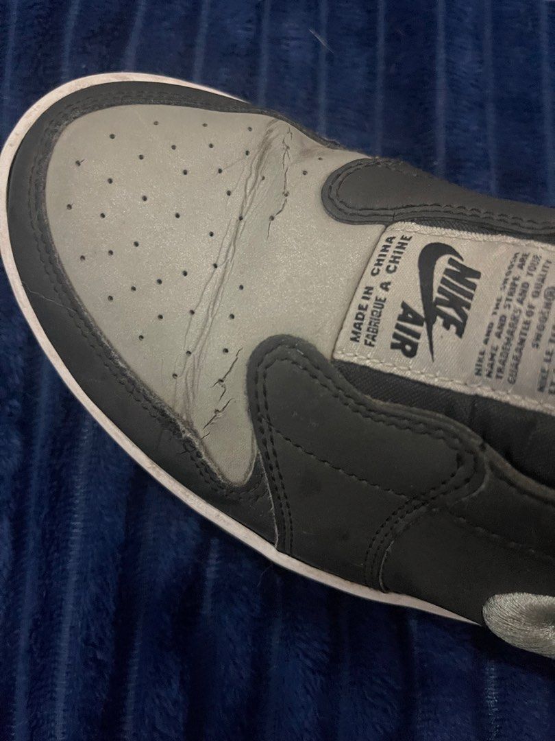 Nike Air Jordan 1 Low (Category: Sneakers) located in Paranaque City. Submitted by politzki (Listing ID 1437362061, Image 2). Description: - Nike Air Jordan 1 Low sneakers - Grey and black colorway - White sole - Nike logo on side and tongue - Air Jordan logo on insoles - Signs of wear on toe box.