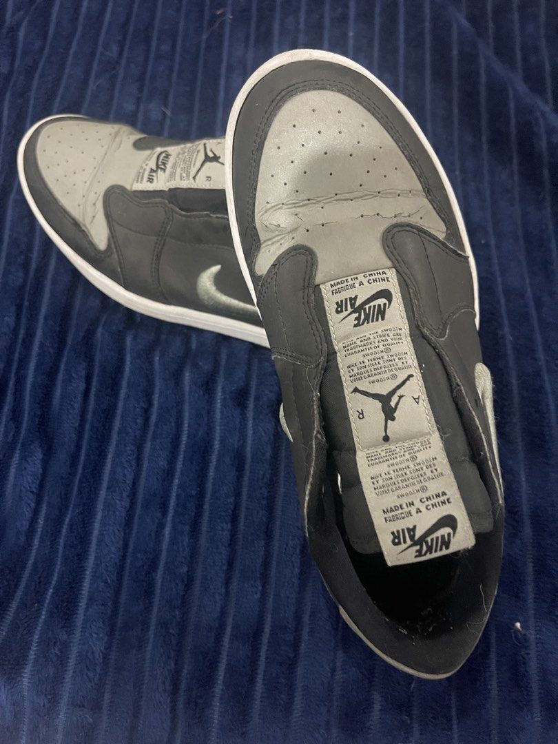 Nike Air Jordan 1 Low (Category: Sneakers) located in Paranaque City. Submitted by politzki (Listing ID 1437362061, Image 1). Description: - Nike Air Jordan 1 Low sneakers - Grey and black colorway - White sole - Nike logo on side and tongue - Air Jordan logo on insoles - Signs of wear on toe box.