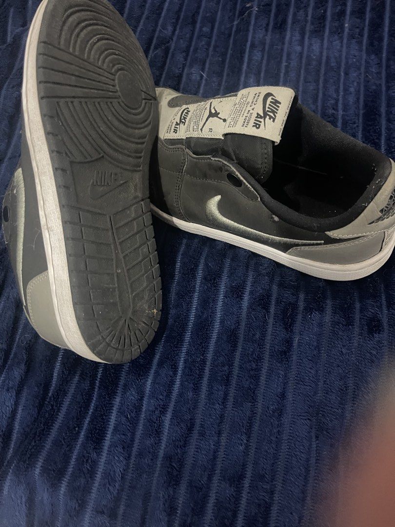 Nike Air Jordan 1 Low (Category: Sneakers) located in Paranaque City. Submitted by politzki (Listing ID 1437362061, Image 3). Description: - Nike Air Jordan 1 Low sneakers - Grey and black colorway - White sole - Nike logo on side and tongue - Air Jordan logo on insoles - Signs of wear on toe box.