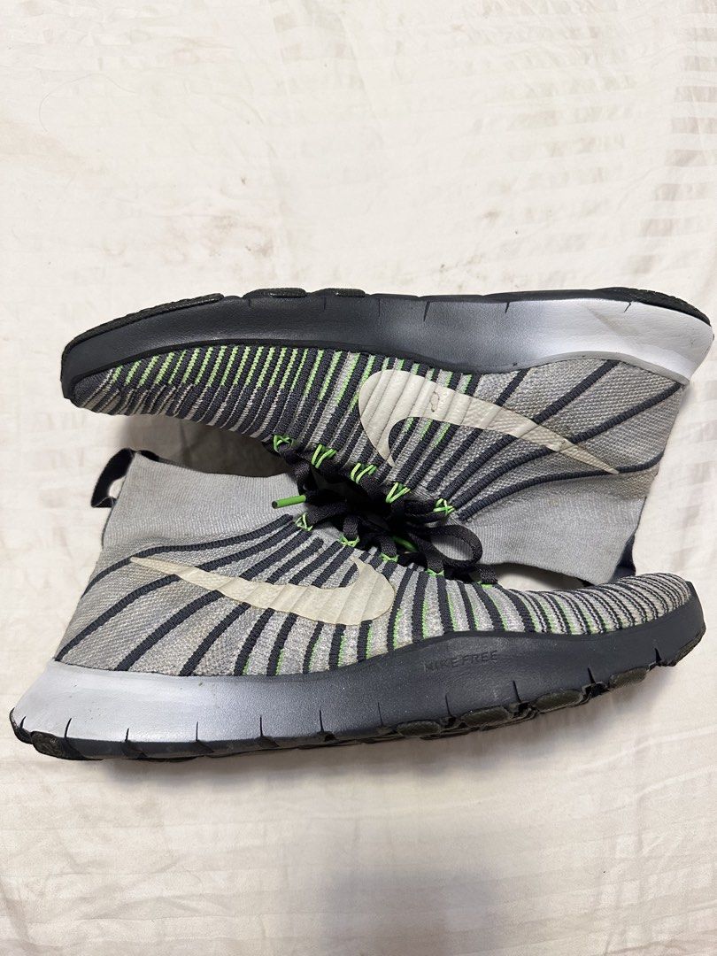 Nike Free RN Flyknit 2017 Sneakers (Category: Sneakers) located in Rodriguez. Submitted by harademetria (Listing ID 1437258174, Image 1). Description: - Nike Free RN Flyknit 2017 - Gray and black striped Flyknit upper - Sock-like collar - Black laces with green accents - White Nike swoosh - Black sole with white midsole and green accents - Soles show some wear.