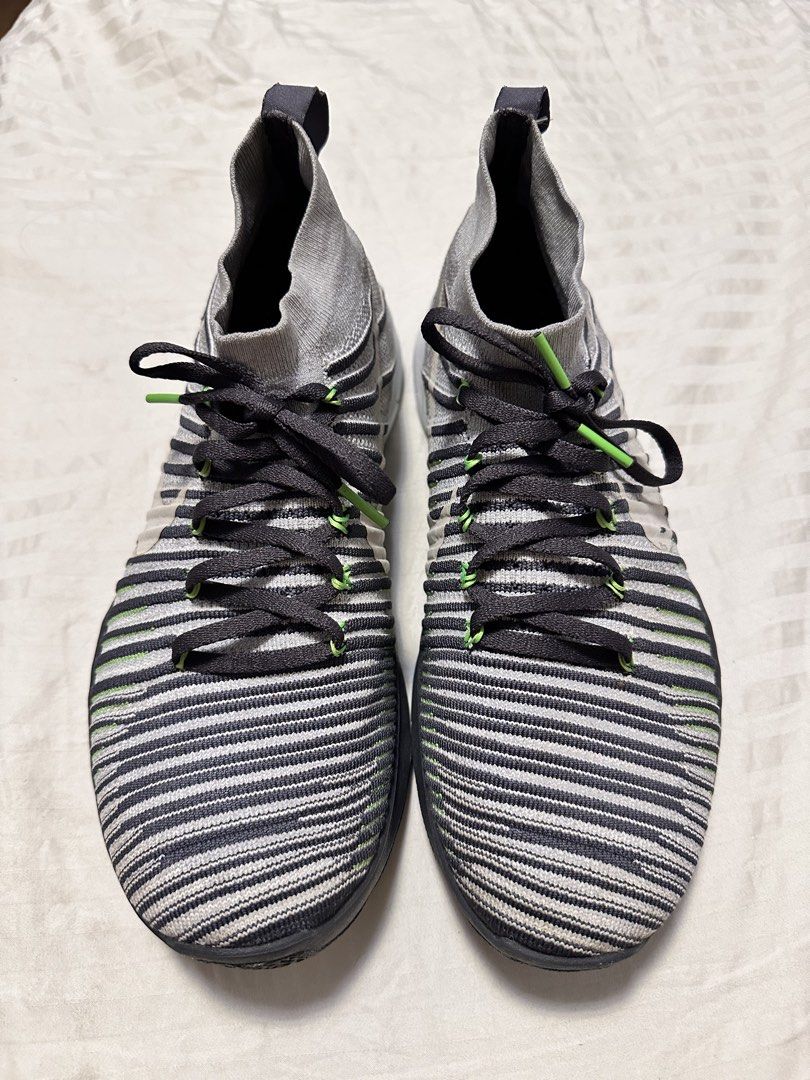 Nike Free RN Flyknit 2017 Sneakers (Category: Sneakers) located in Rodriguez. Submitted by harademetria (Listing ID 1437258174, Image 2). Description: - Nike Free RN Flyknit 2017 - Gray and black striped Flyknit upper - Sock-like collar - Black laces with green accents - White Nike swoosh - Black sole with white midsole and green accents - Soles show some wear.