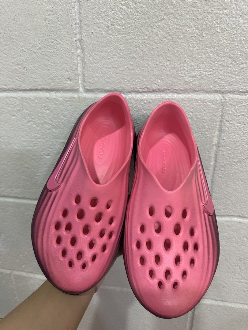 Nike ReactX Rejuven8 Slides (Category: Slippers and slides) located in Quezon City. Submitted by heyyjaaay (Listing ID 1437291841, Image 1). Description: Size: US WOMEN’s 6 / Men’s 5 Used twice, bought May 2026 RFS: sobrang sakto ng size; need to size up Will provide a nike box Will sanitize before shipping - Nike ReactX Rejuven8 Slides in Pink - Breathable design with multiple holes - Textured sole for grip - Sleek, modern look - Nike logo visib